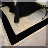 DR10. Black and ivory wool rug.